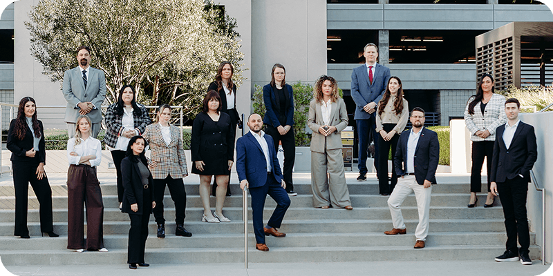 Frontier Law Center employment law team standing on outdoor steps at the firm's Woodland Hills, California office