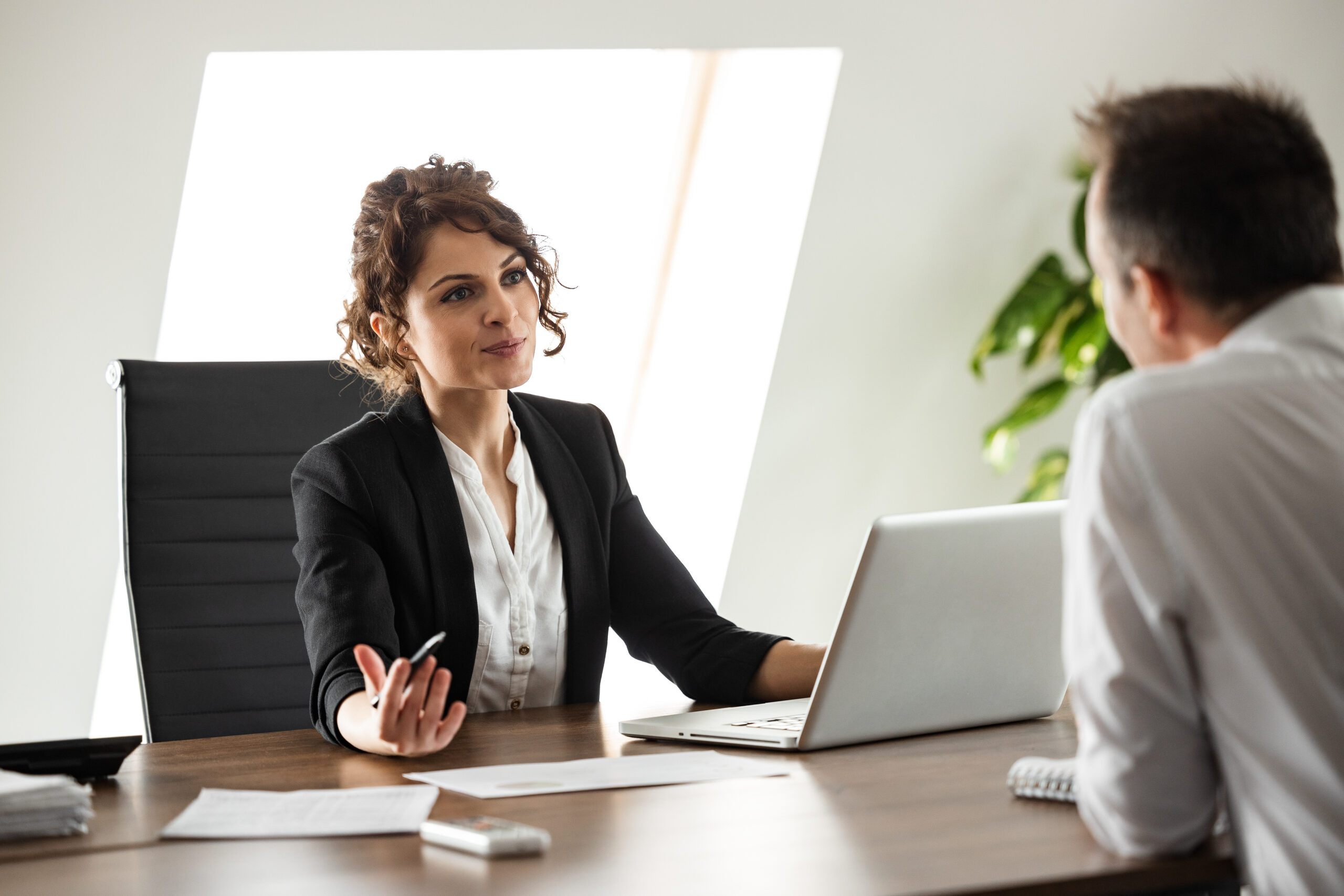 Attorney consulting with a client about a whistleblower retaliation case at a California law firm