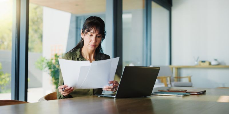 California employee reviewing wrongful termination claim documents at home