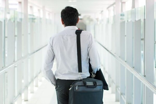 An employee walks away from an office after being fired for suing their employer in California