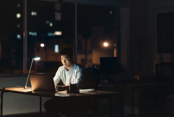 California employee working late overtime hours at the office