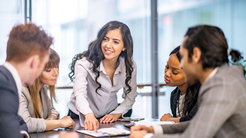 Diverse Team Discussing California Employee Rights in Office Meeting