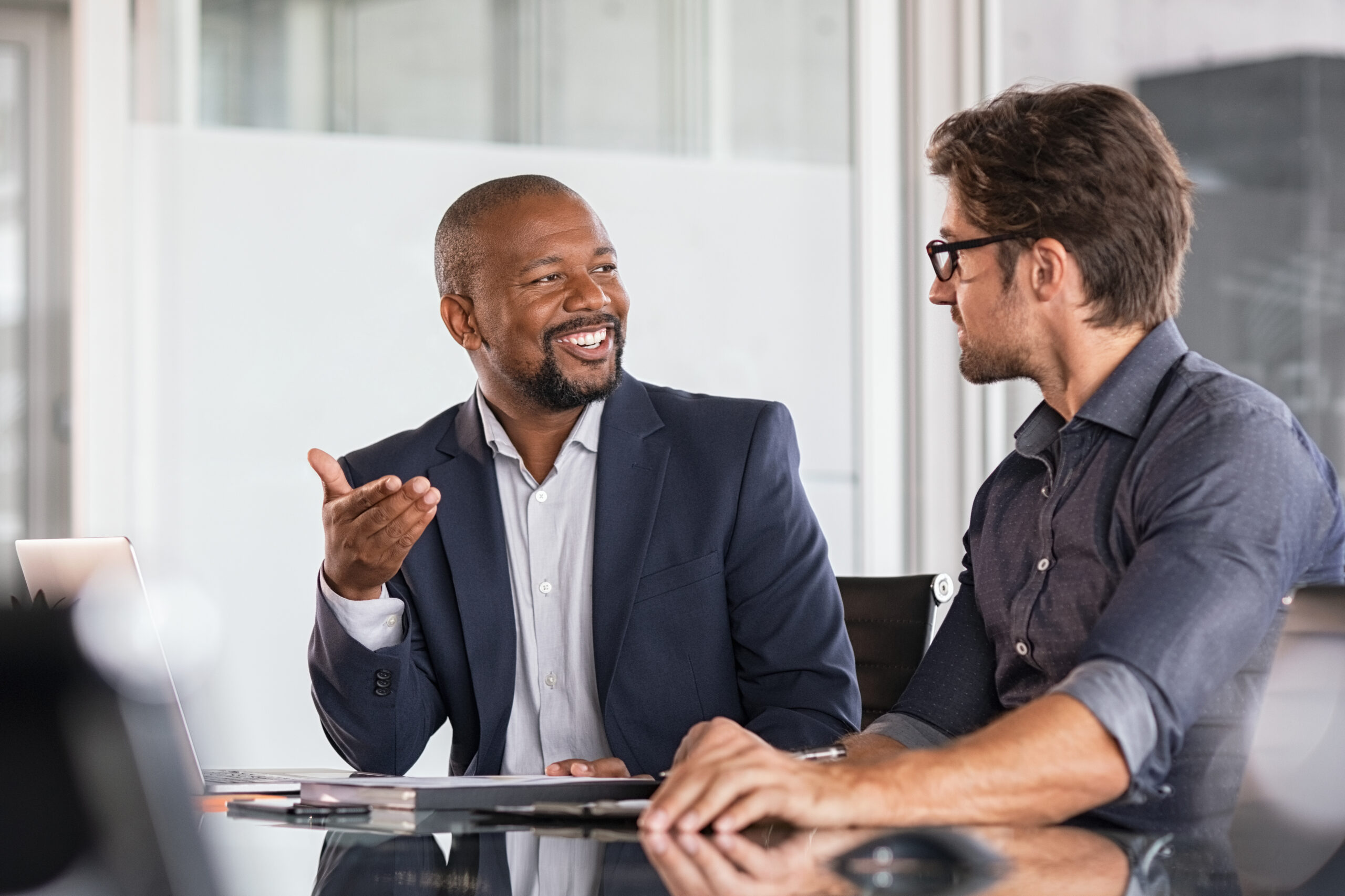 Attorney and client discussing a wrongful termination case settlement in California