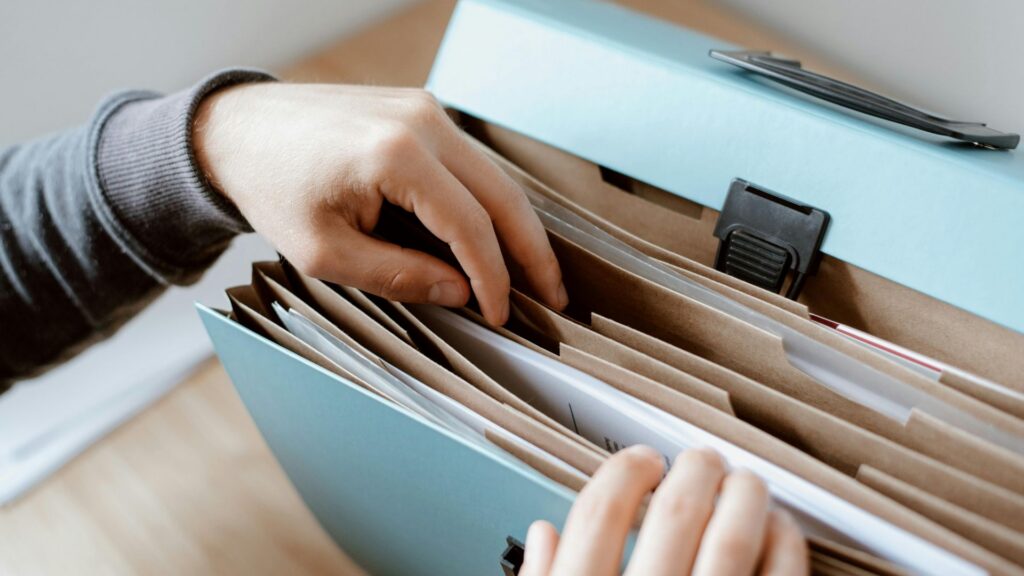 Person gathering records and employment documents to file a wrongful termination claim