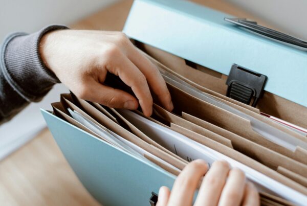 Person gathering records and employment documents to file a wrongful termination claim