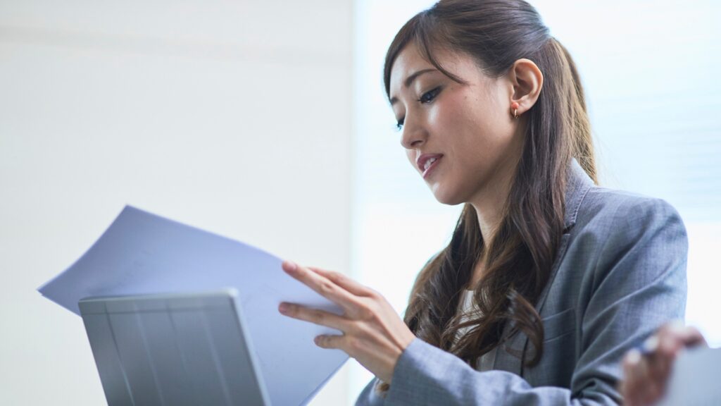 Professional reviewing employment documents for a California wrongful termination case