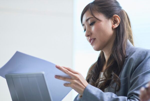 Professional reviewing employment documents for a California wrongful termination case