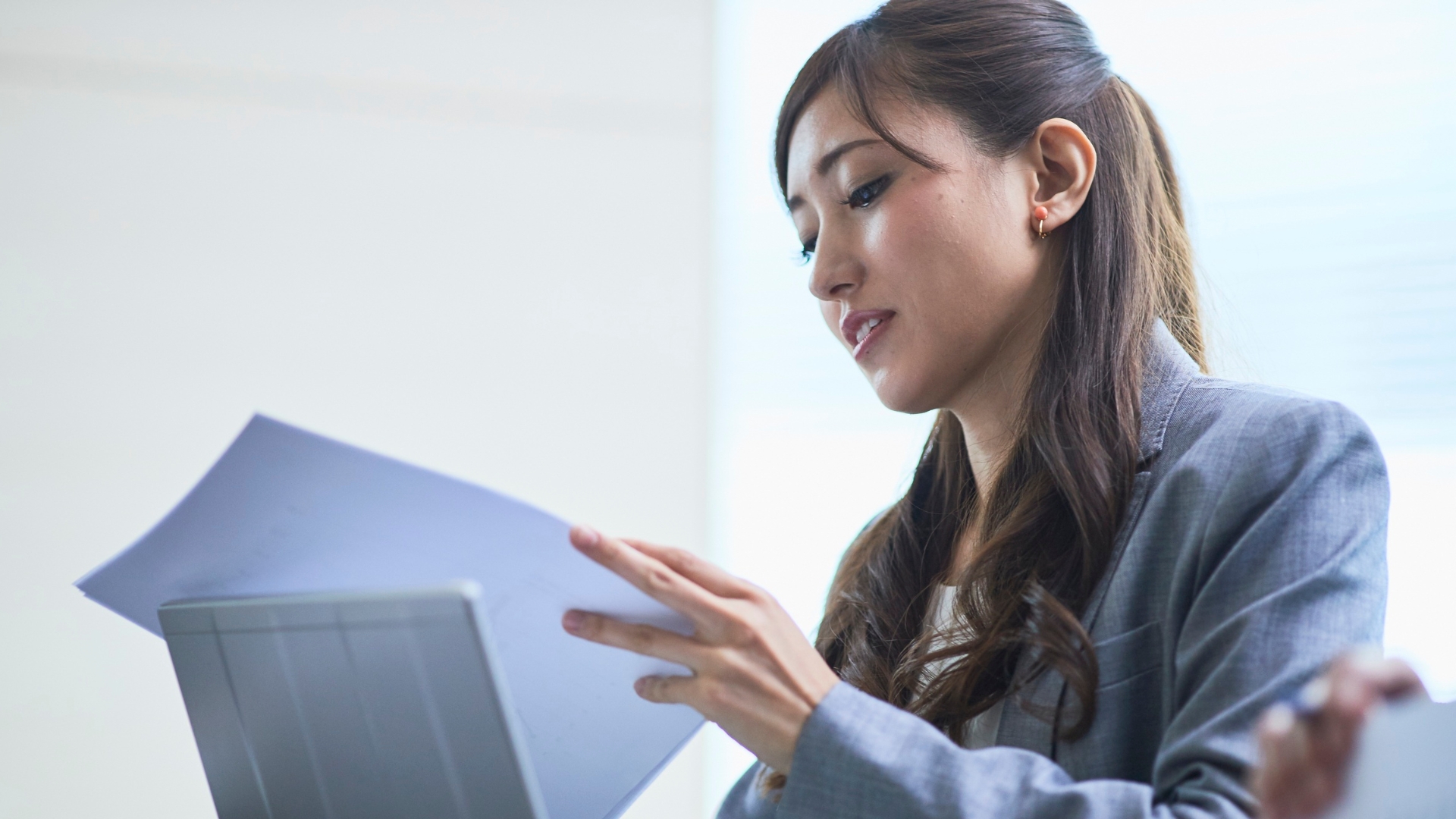 Professional reviewing employment documents for a California wrongful termination case