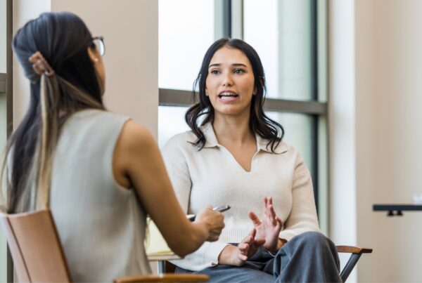 California employee speaking with an employment attorney about signs of sexual harassment at work during a free case evaluation