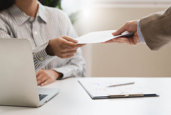 Employee receiving paycheck — California statute of limitations for unpaid wages applies to each payment date