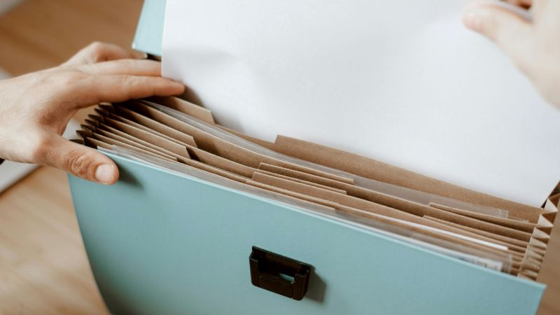 A person retrieving personnel file documents to build evidence in a California wrongful termination case