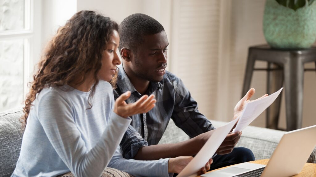 Two employees reviewing documents to establish timing evidence in a workplace retaliation claim