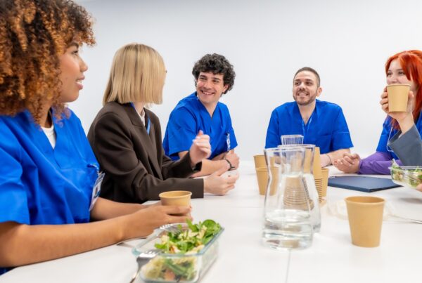 California employees discussing a gender discrimination at work concern during a break