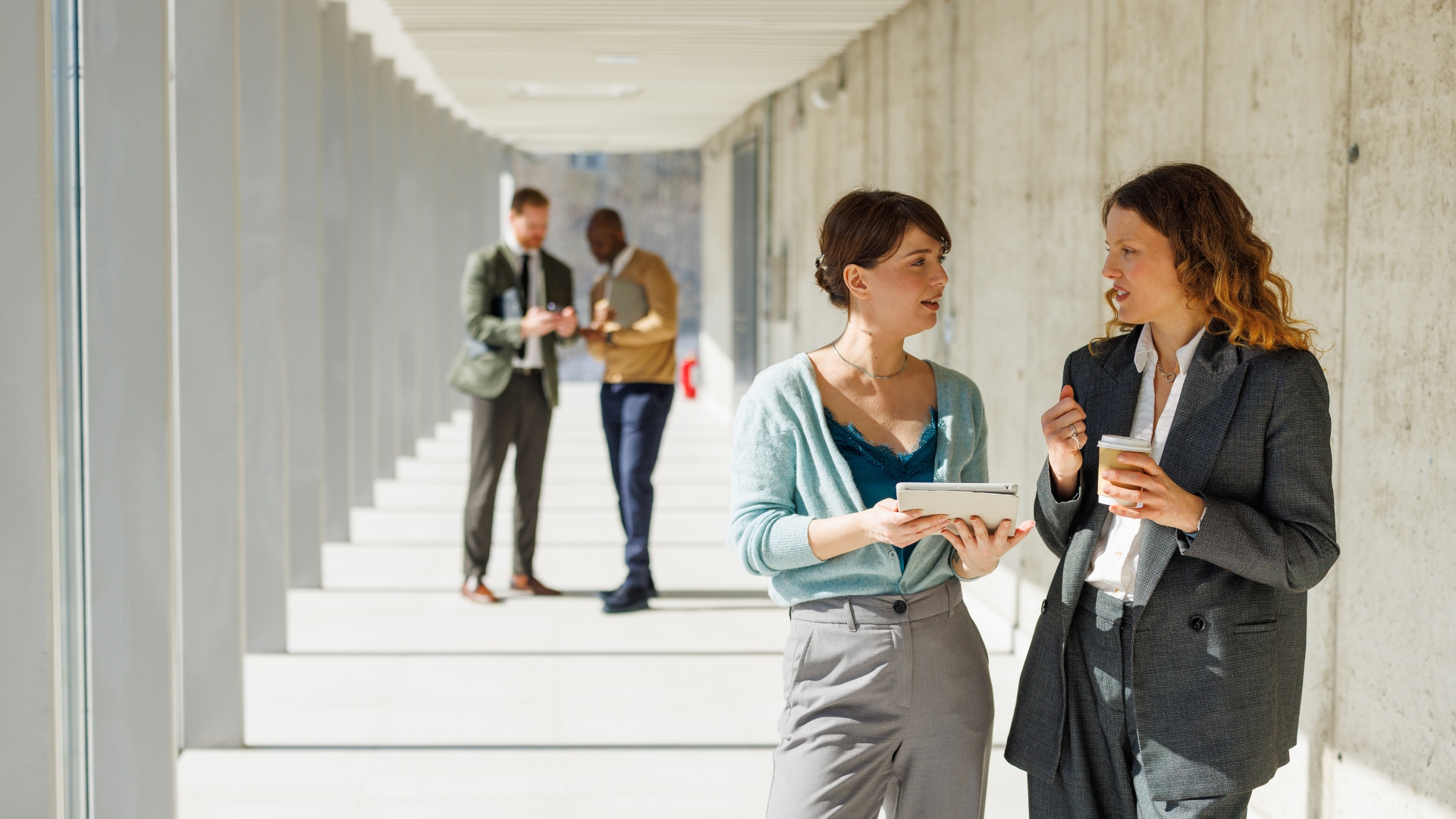 Los Angeles coworkers comparing pay stubs, a common sign of a class action wage claim