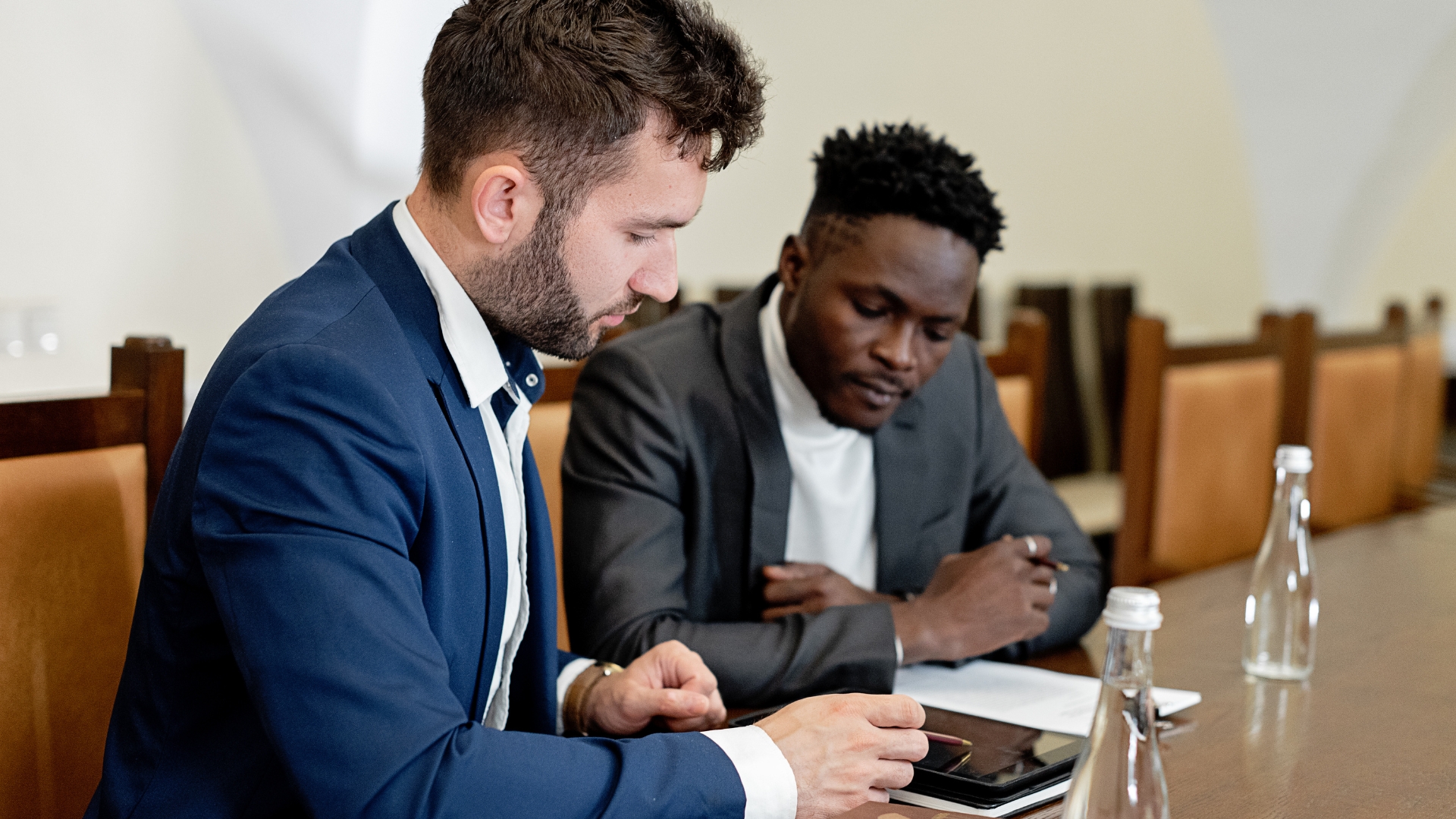 Two professionals reviewing an unpaid wage claim — California statute of limitations for back wages
