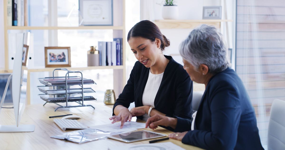 Orange County employment lawyer reviewing case documents with a client during a consultation