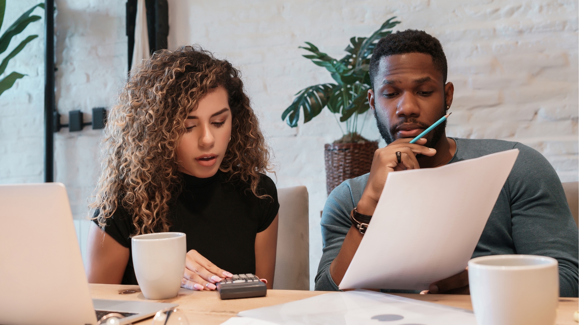 Los Angeles employees reviewing a pay stub discrepancy before contacting a Los Angeles wage and hour lawyer