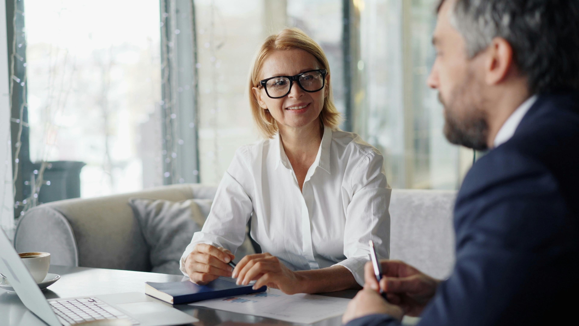 An attorney reviews documents with a client during a consultation about unpaid California overtime wages