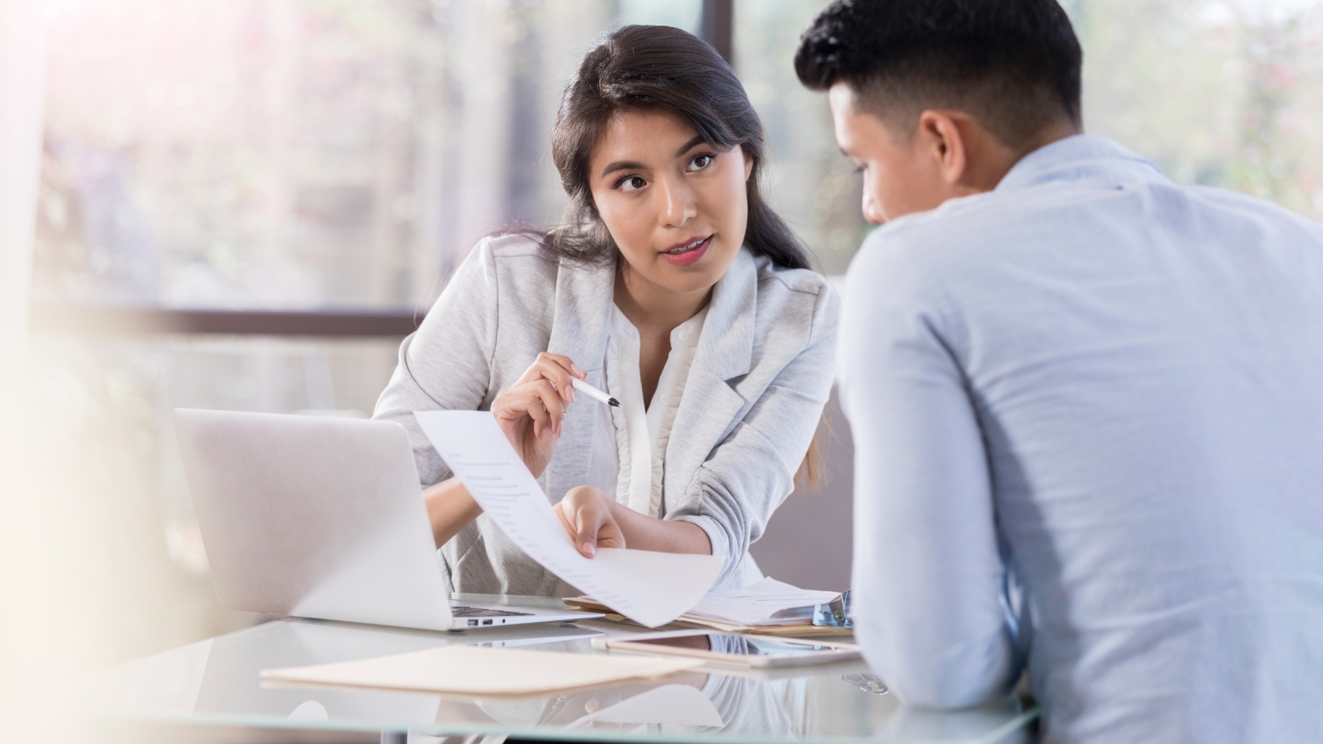 Employee reviewing paperwork with an advisor, a key step for anyone building a religious discrimination in the workplace case