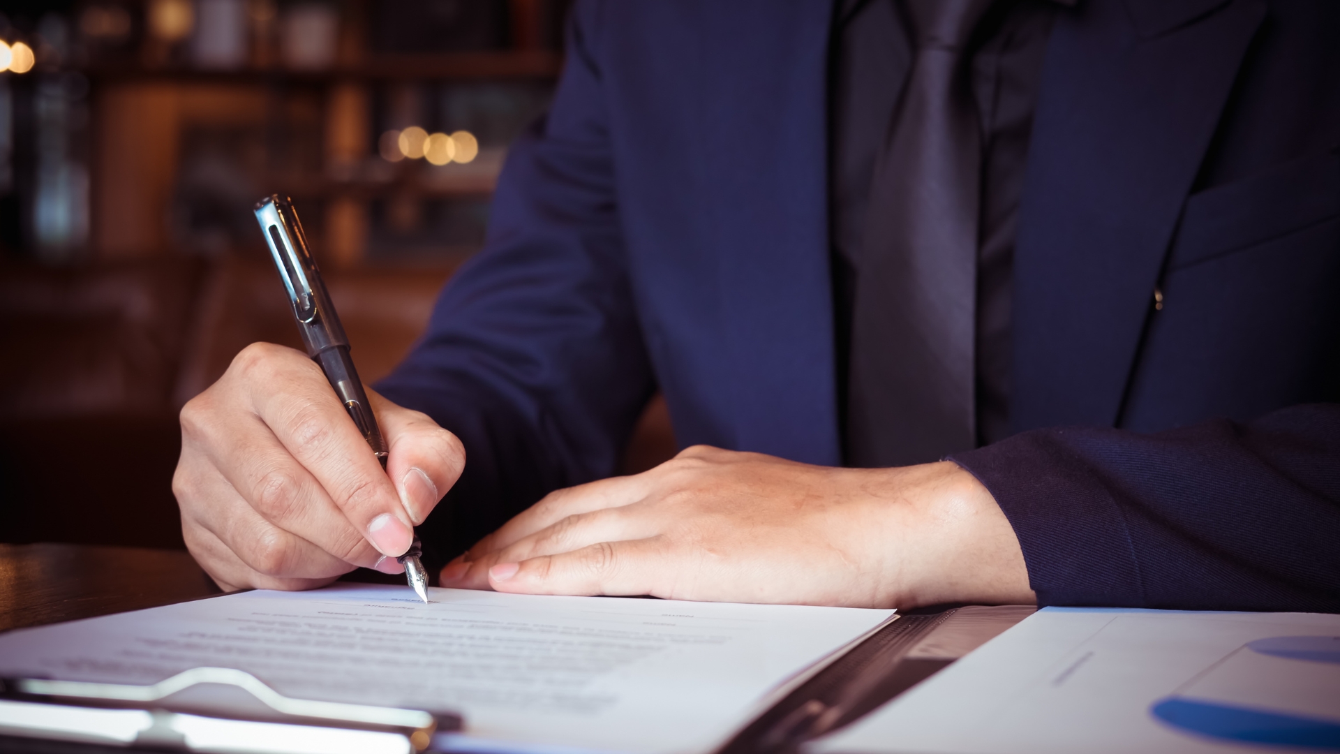 San Jose employment lawyer signing paperwork to file an employee's workplace claim