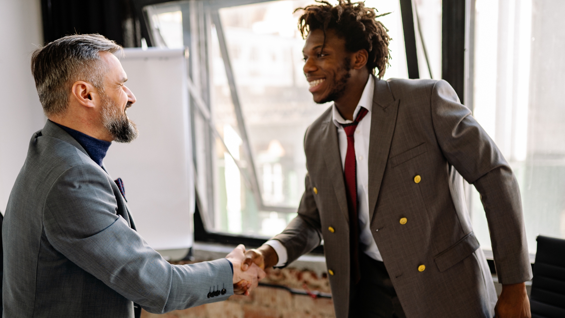 A California employee shakes hands with an employment attorney to discuss proving discrimination at work