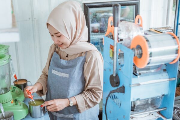 Employee wearing a hijab while working at a food service job, the kind of religious dress protected from religious discrimination in the workplace