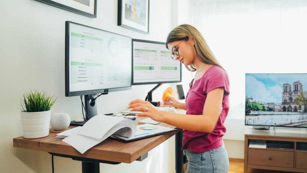 California employee standing at an adjustable desk, a reasonable accommodation for a physical disability